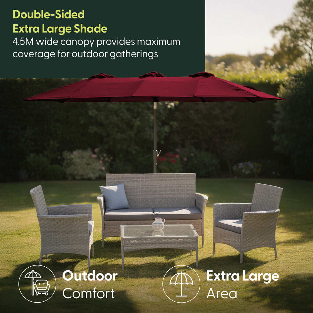 4.5M double garden parasol in red shading rattan garden furniture set on a lawn