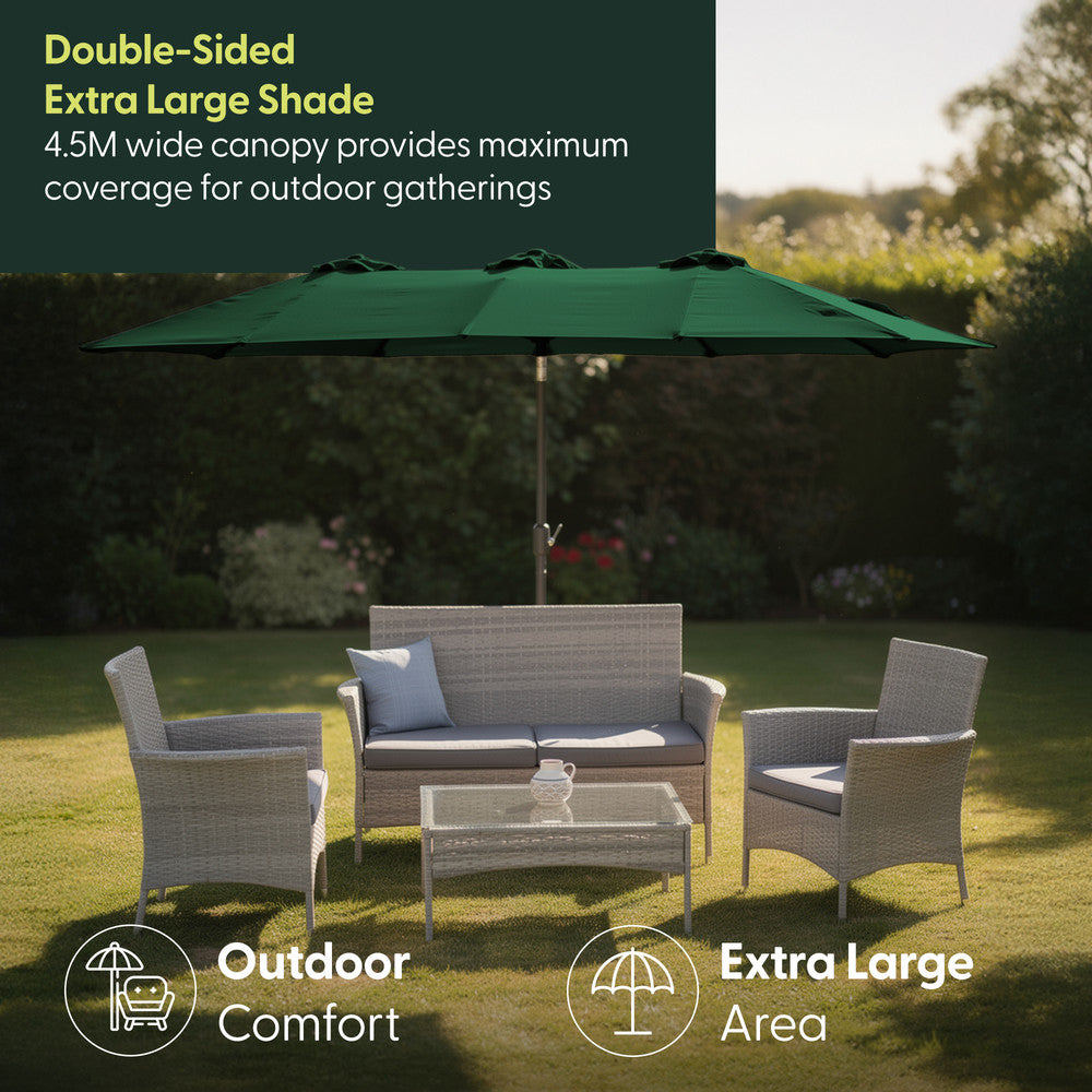 4.5M double garden parasol in green shading rattan garden furniture set on a lawn