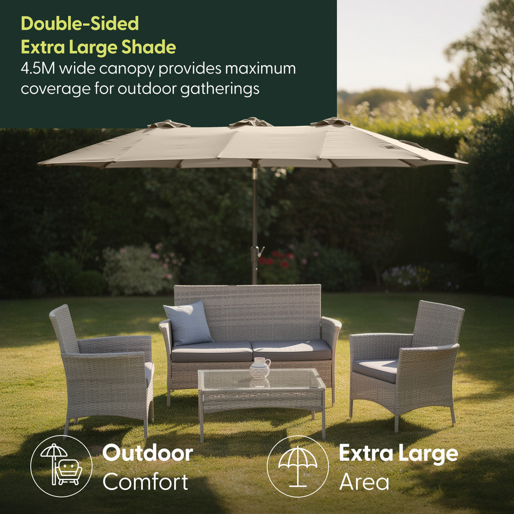 4.5M double garden parasol in cream shading rattan garden furniture set on a lawn