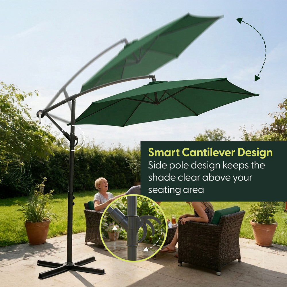 Green 3m offset cantilever garden parasol with side pole rotating over garden chairs on patio – shade kept clear above outdoor seating area