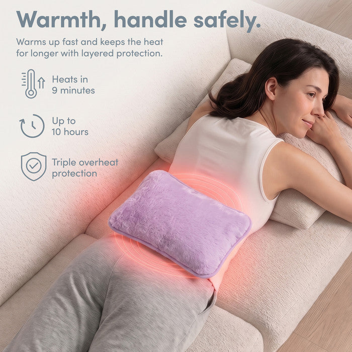 Lilac electric heat pad on lower back, heats in 9 minutes and stays warm 10 hours