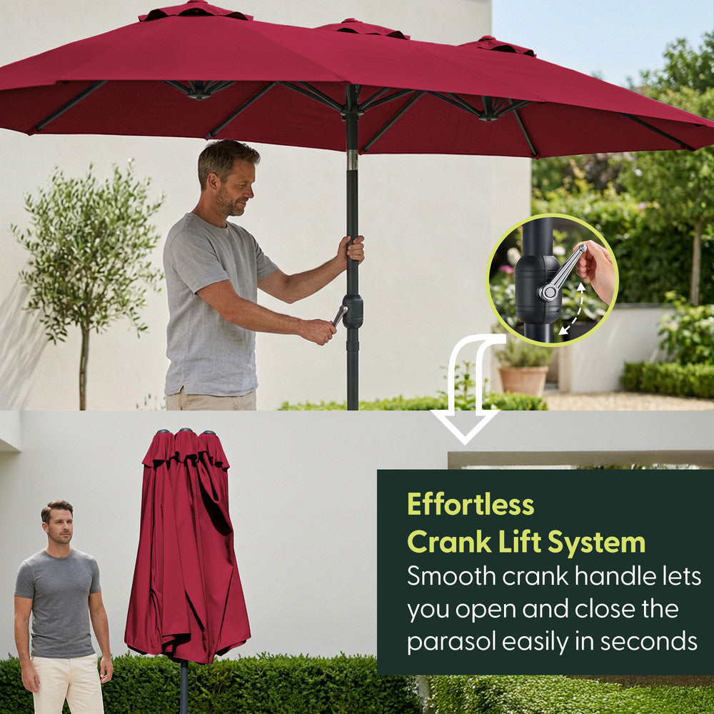 Man using crank handle to open red double garden parasol – effortless open and close mechanism