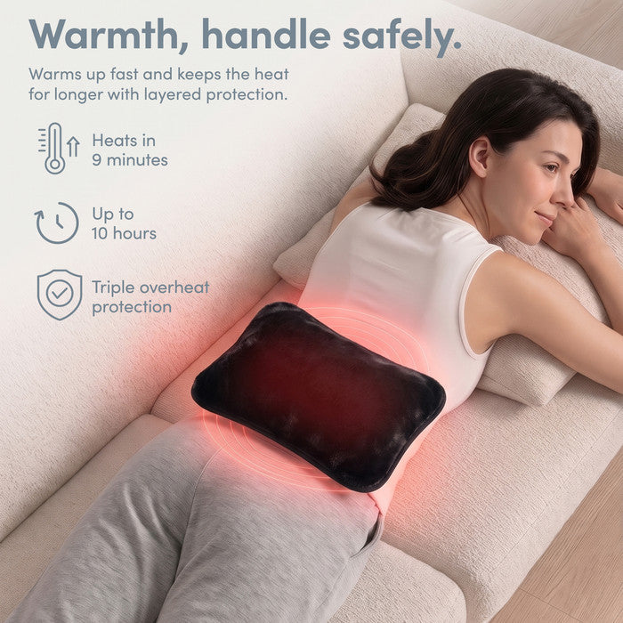 Black electric heat pad on lower back, heats in 9 minutes and stays warm 10 hours