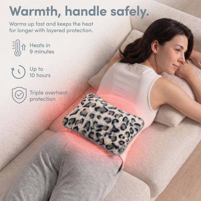 Animal Print electric heat pad on lower back, heats in 9 minutes and warm for 10 hours