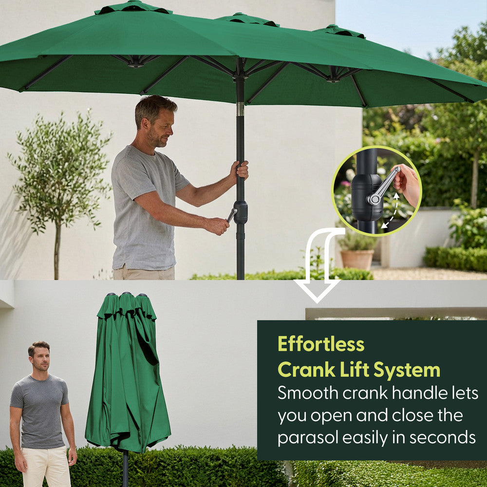 Man using crank handle to open green double garden parasol – effortless open and close mechanism