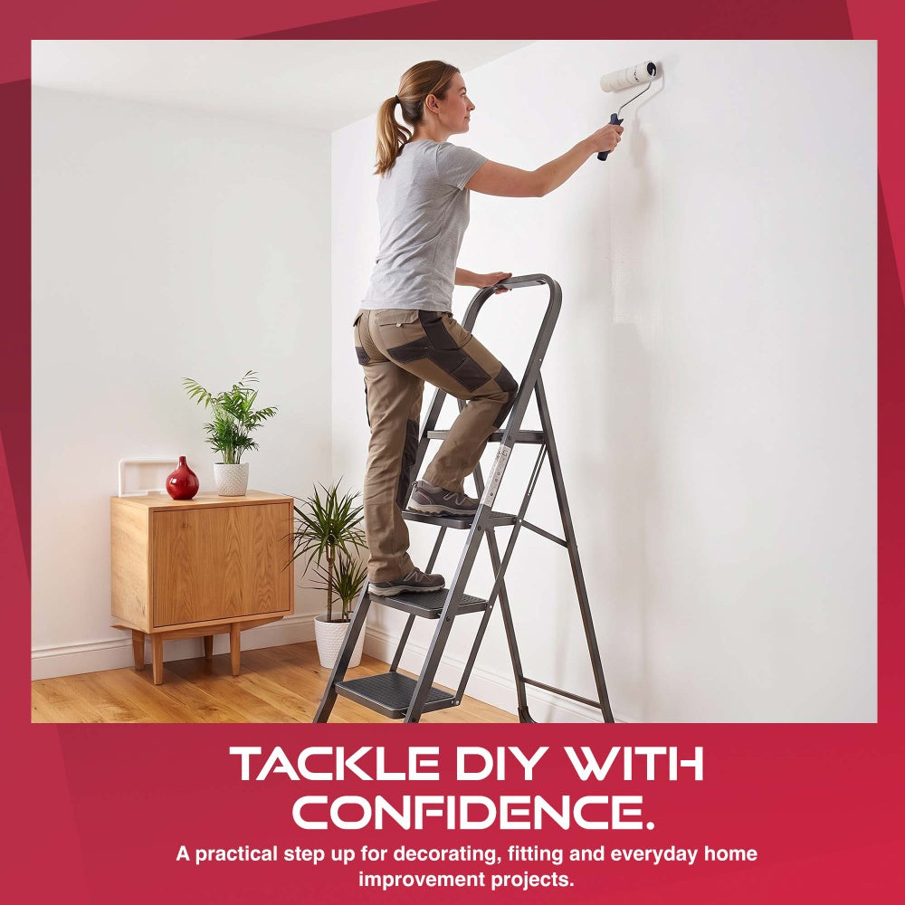 Person painting a wall from a Haltons 4 step folding ladder