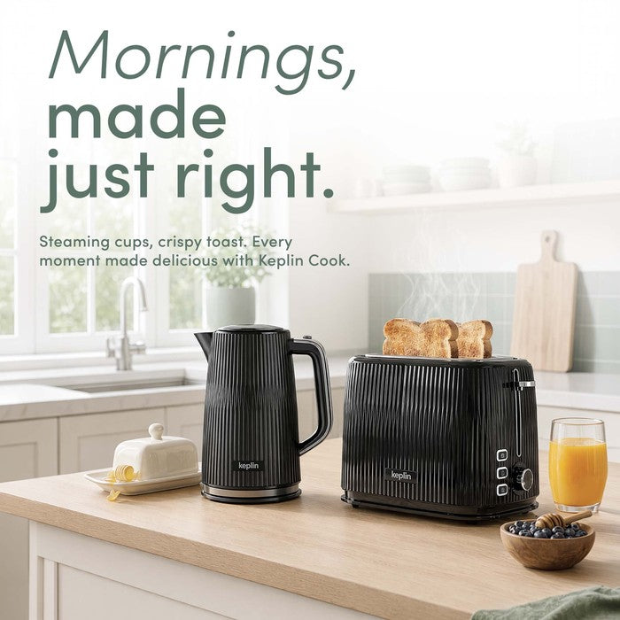 Black ribbed Keplin electric kettle and matching black toaster on a bright kitchen worktop, with toast, orange juice and breakfast items nearby.