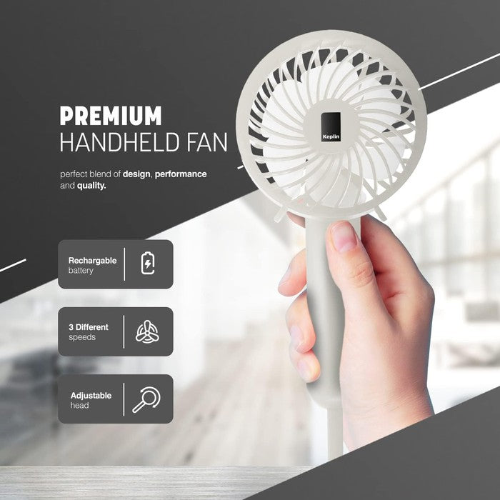 Keplin white handheld fan with rechargeable battery, 3 speed settings and adjustable head, held in hand