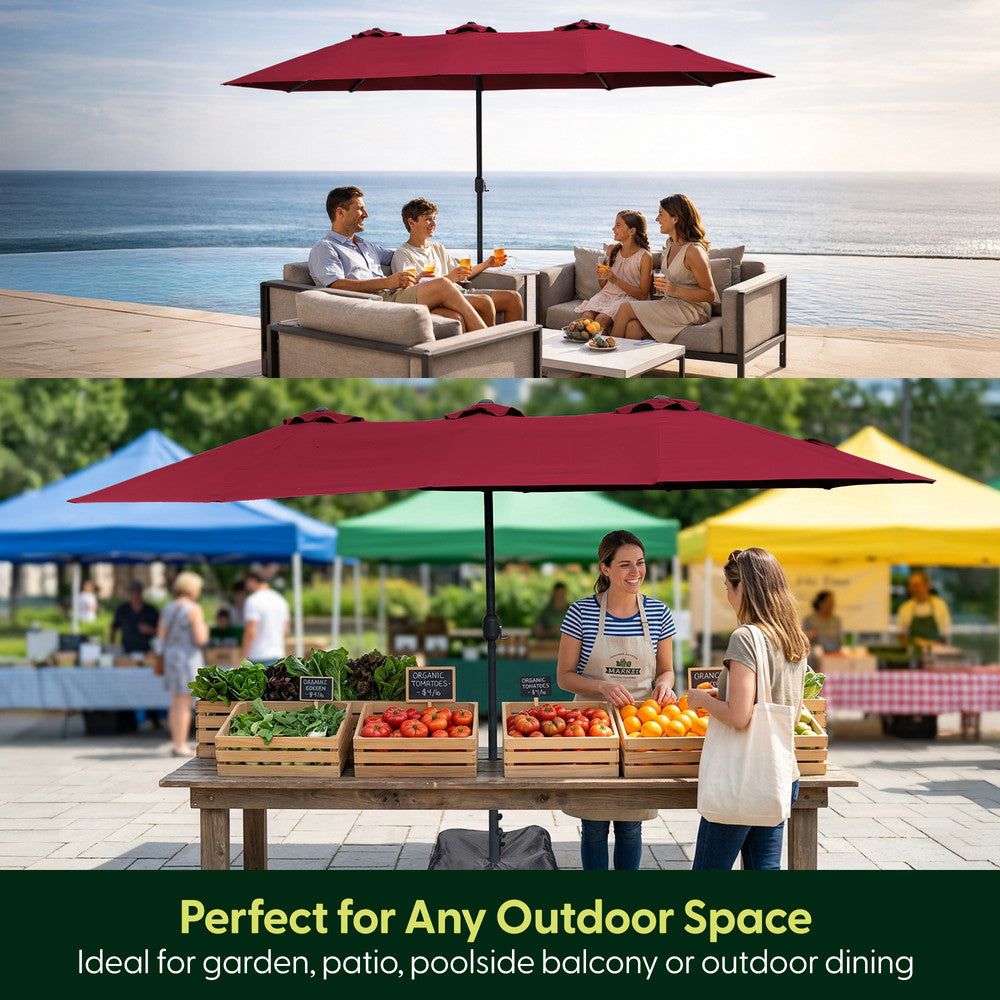Red double parasol used over garden seating by the sea and as outdoor market stall shade