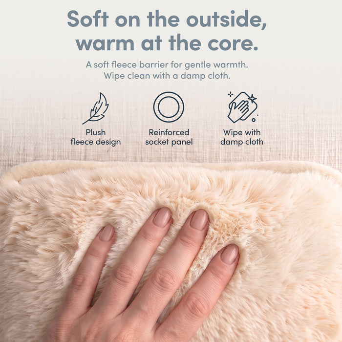 Hand on plush Cream fleece cover of electric hot water bottle, wipe clean when needed