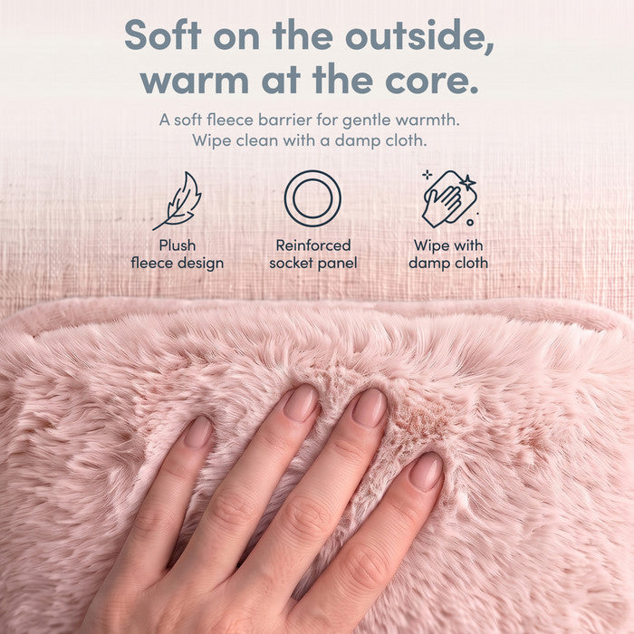 Hand on plush Blush fleece cover of electric hot water bottle, wipe clean when needed