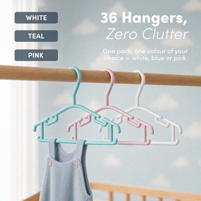 White, teal and pink baby hangers hanging together on a wooden nursery rail