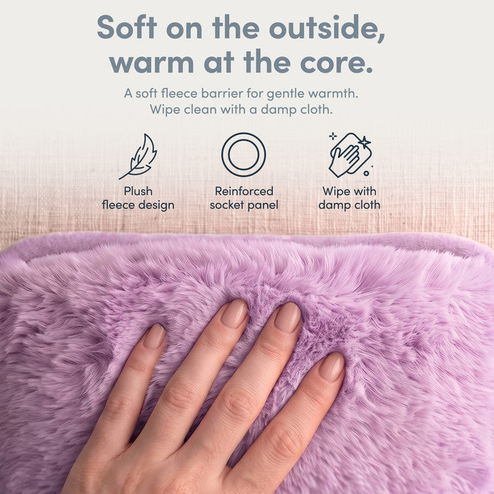 Hand on plush Lilac fleece cover of electric hot water bottle, wipe clean when needed
