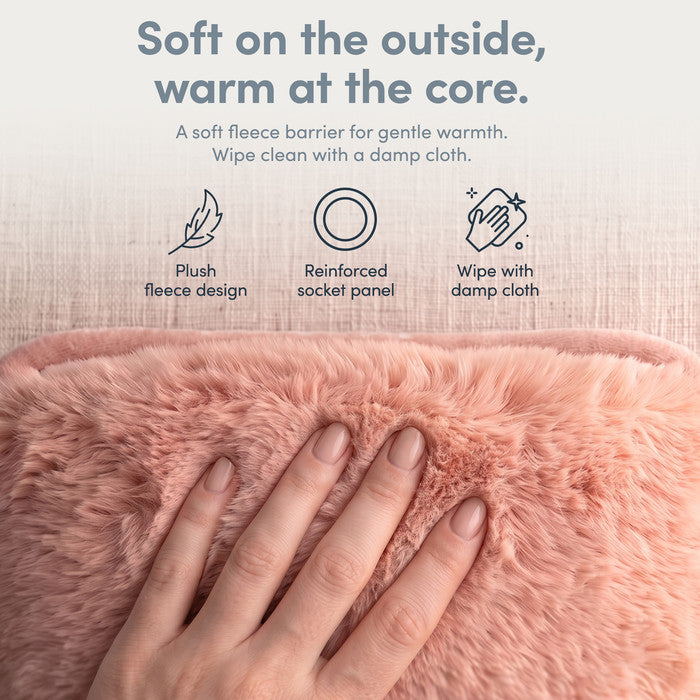 Hand on plush Blush fleece cover of electric hot water bottle, wipe clean when needed