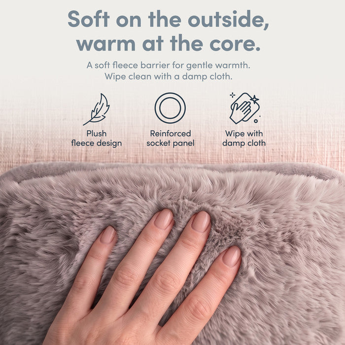 Hand on plush Grey fleece cover of electric hot water bottle, wipe clean when needed