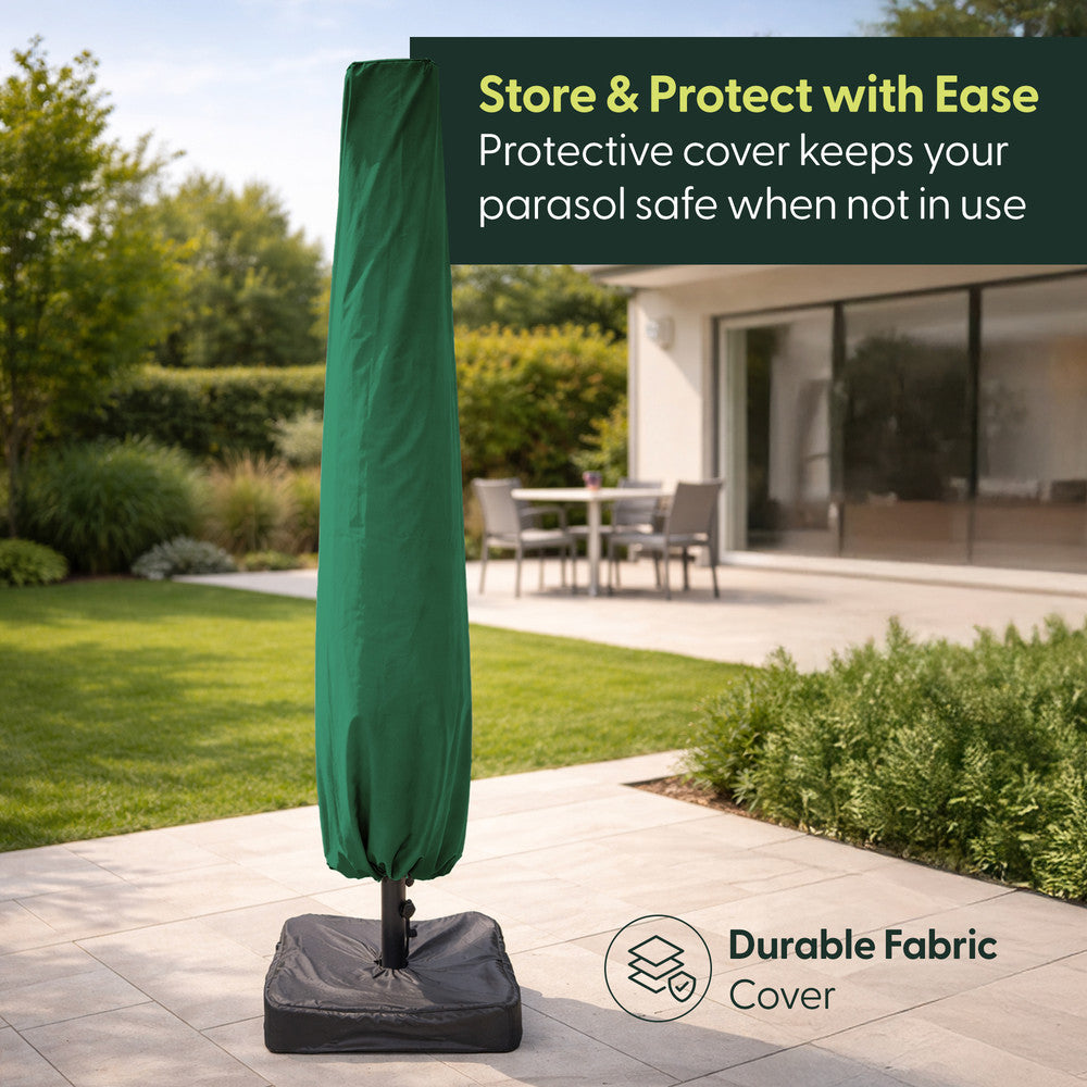 Green double parasol stored in protective fabric cover on weighted base in a garden
