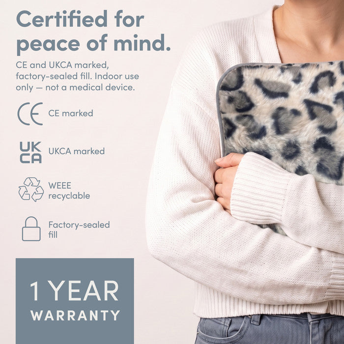 Animal Print electric hot water bottle held close, CE and UKCA marked, 1 year warranty