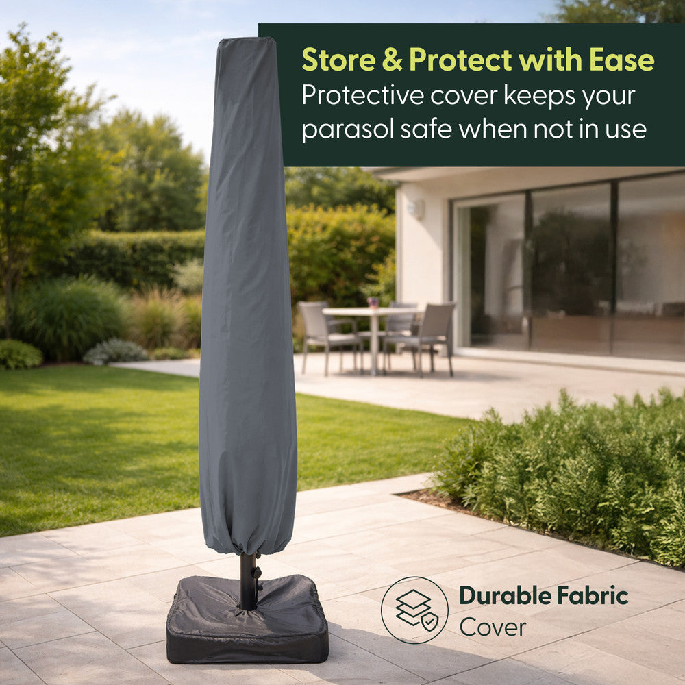 Grey double parasol stored in protective fabric cover on weighted base in a garden
