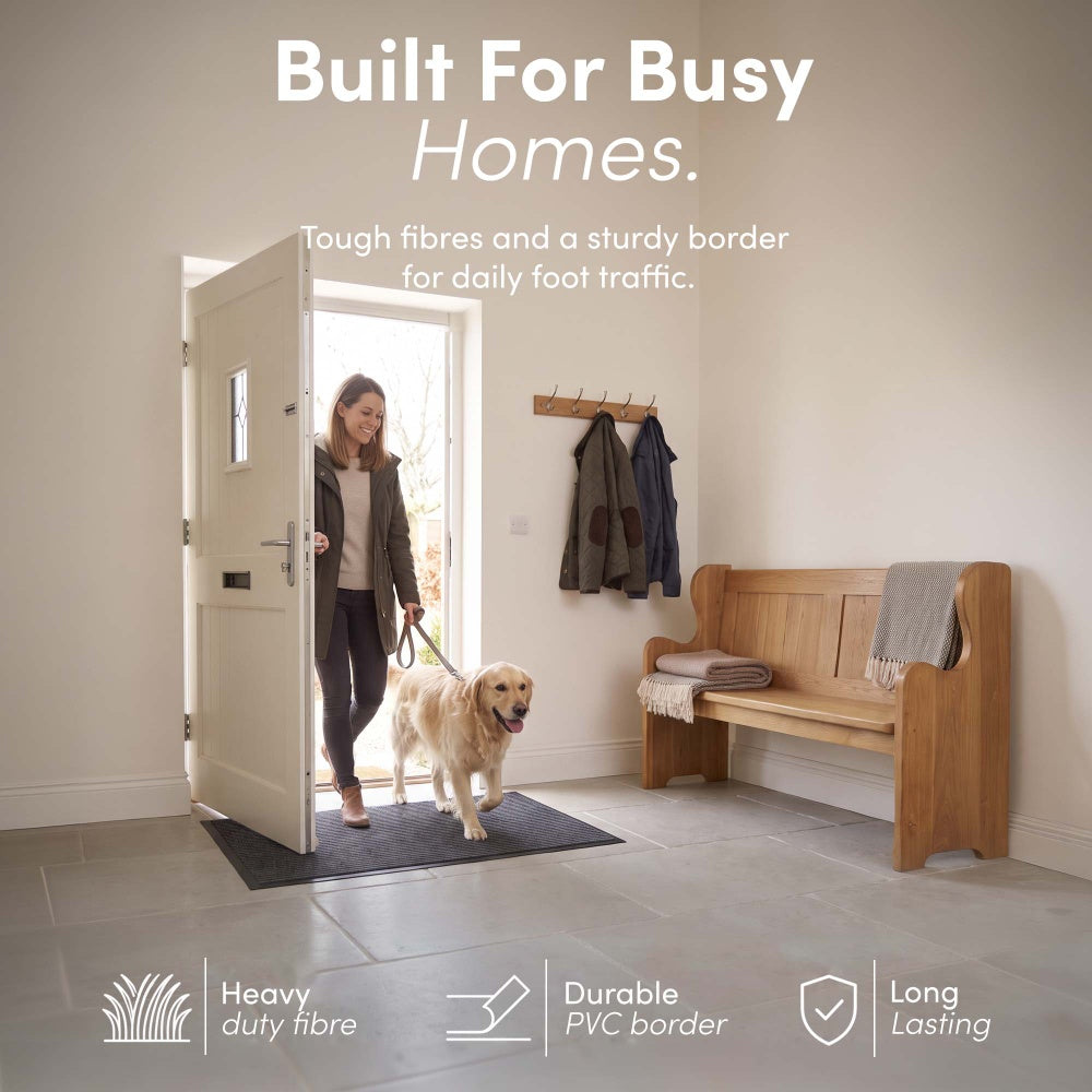 Dog and owner entering hallway over tough-fibre mat for daily foot traffic – Hallway Door Mat