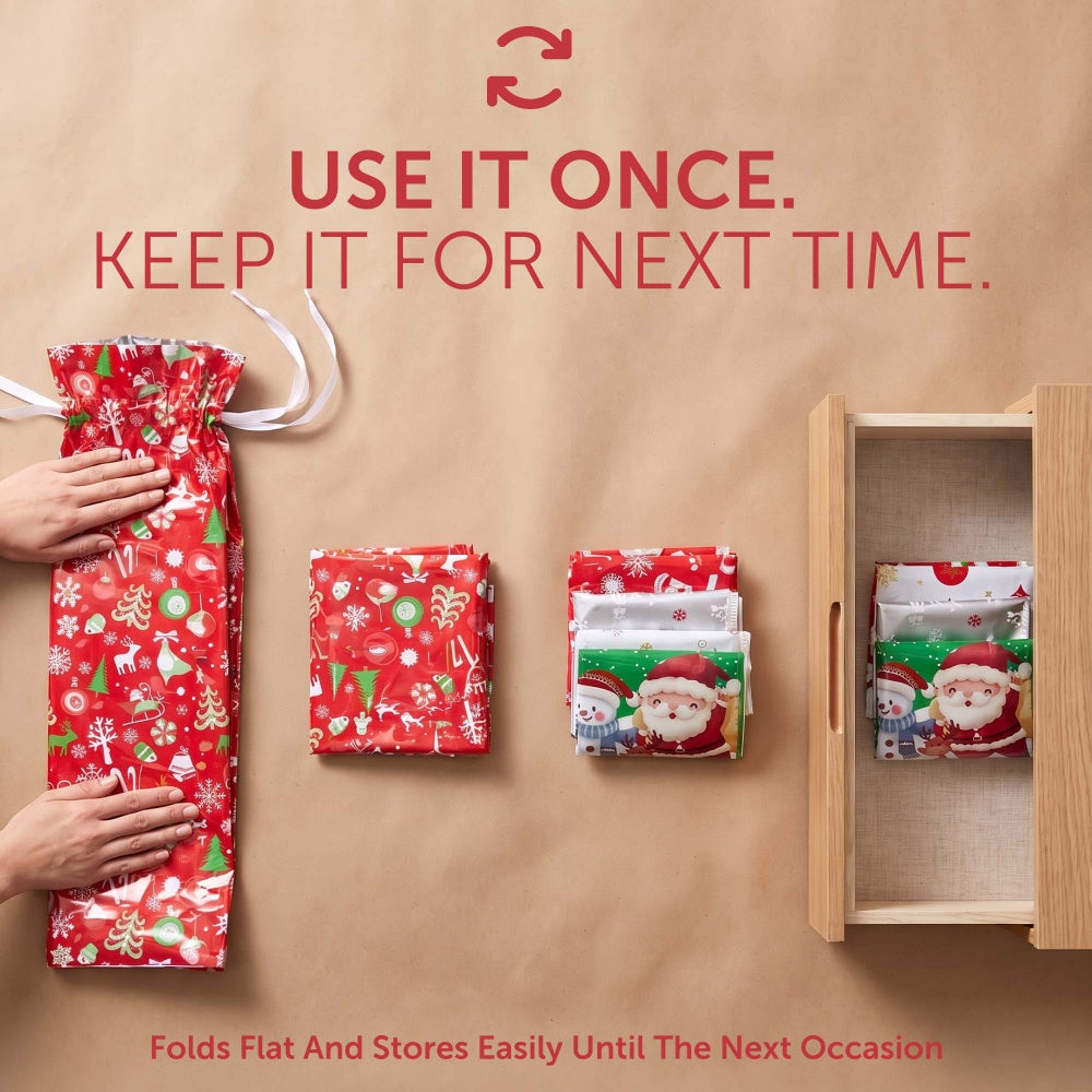 Festive foil gift bags folded flat and stored in a drawer, reusable season after season