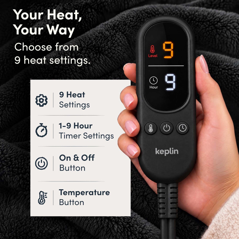 Hand holding remote on black and grey electric throw, 9 heat settings, 1-9 hour timer