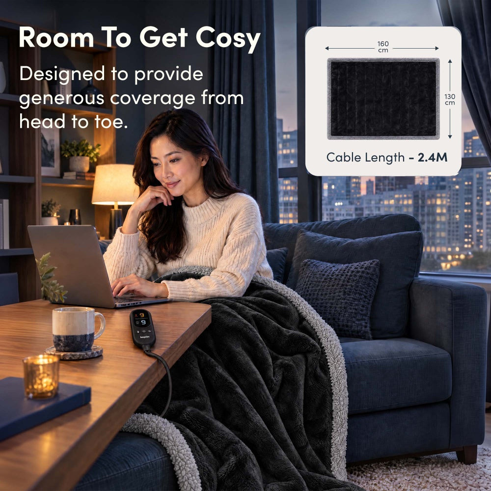 Woman on laptop under black and grey electric throw, 160 x 130cm size with 2.4m cable
