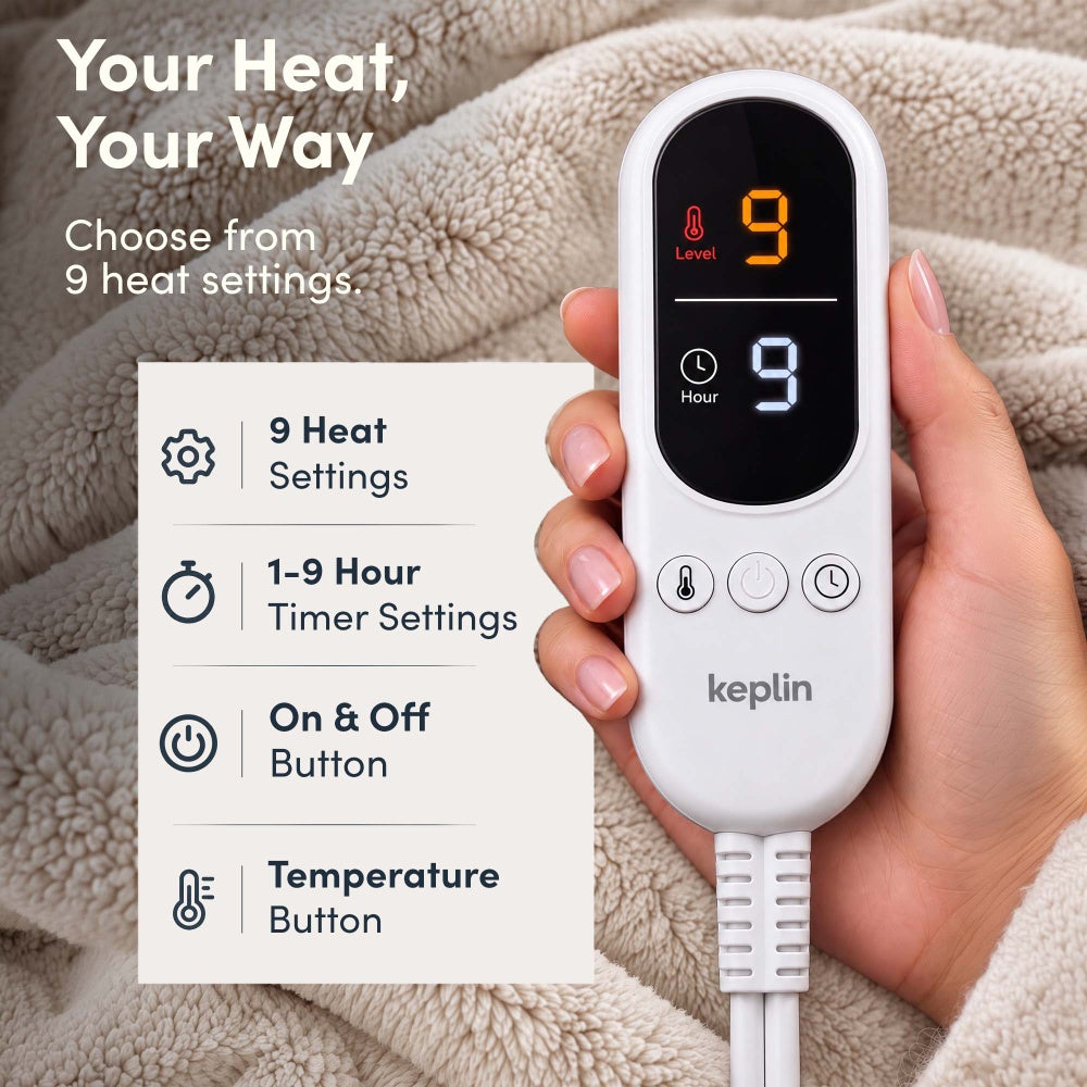 Hand holding remote on cream electric throw, 9 heat settings, 1-9 hour timer