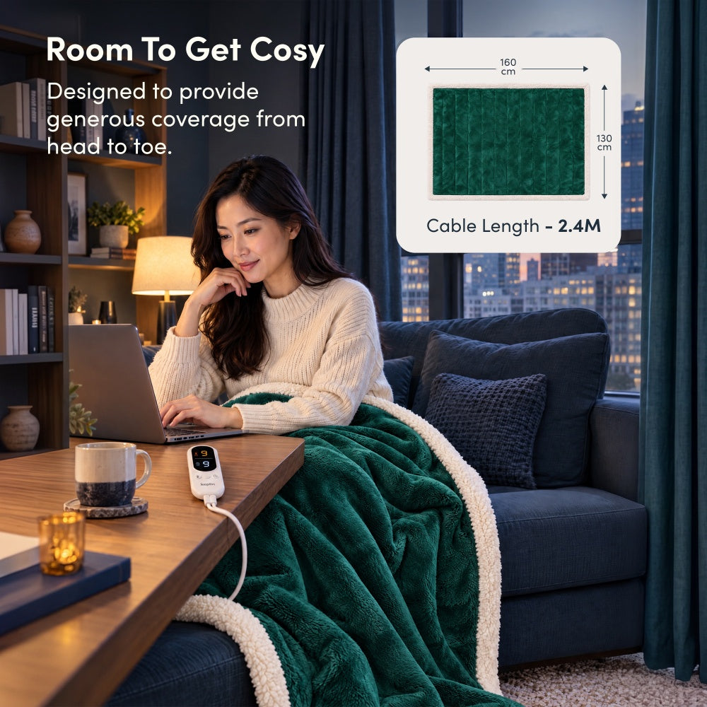 Woman on laptop under emerald green electric throw, 160 x 130cm size with 2.4m cable