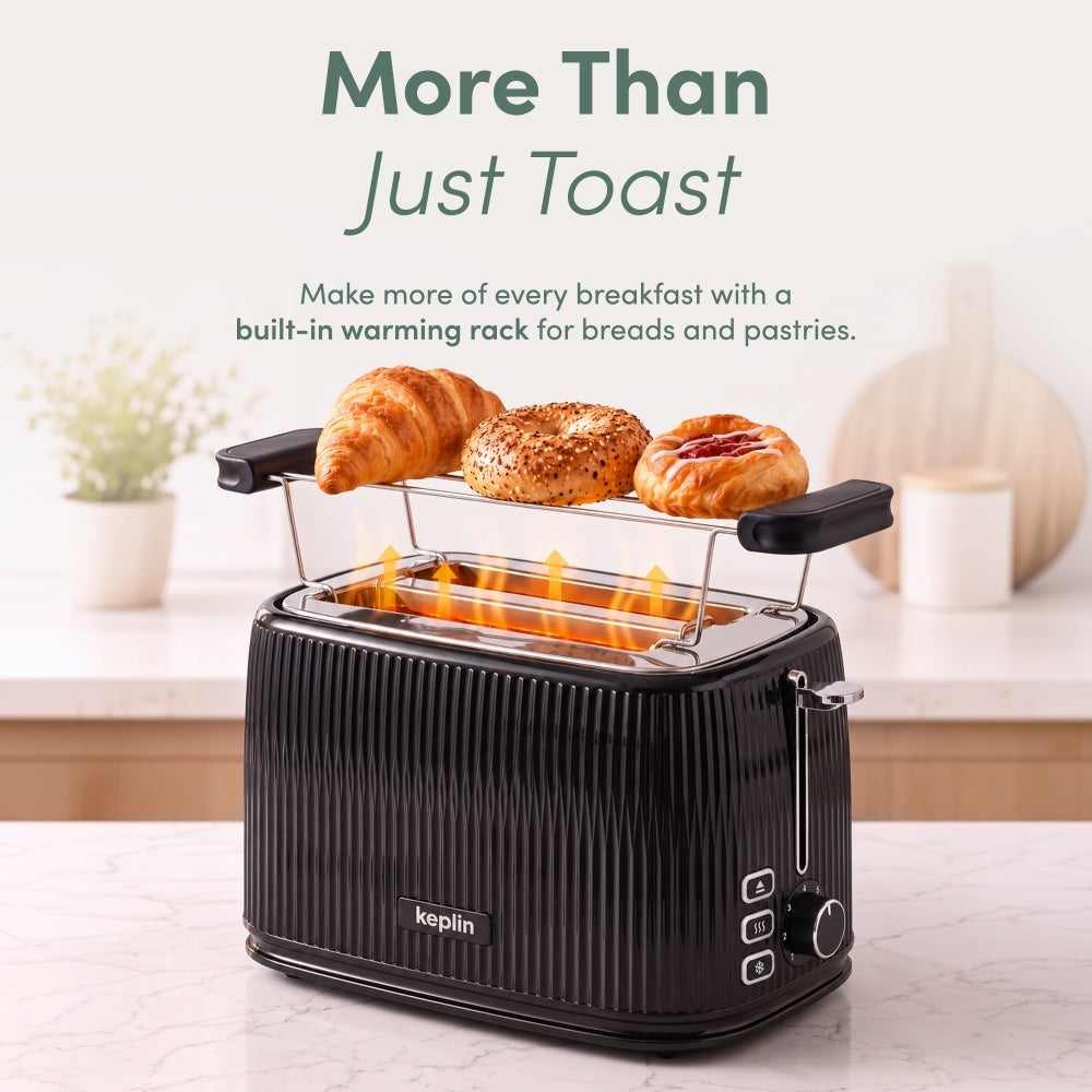 Keplin 2 slice toaster warming rack heating a croissant, bagel and pastry over the slots