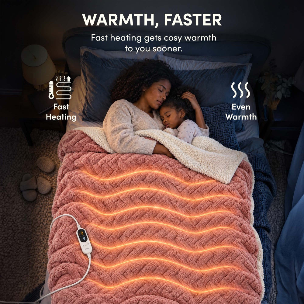 Woman and child asleep under rose pink jacquard electric heated throw with fast, even heating