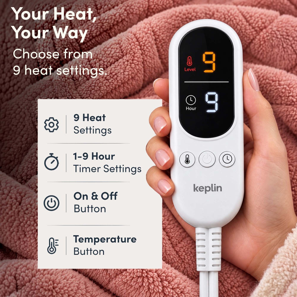 Hand holding remote on rose pink jacquard electric throw, 9 heat settings, 1-9 hour timer
