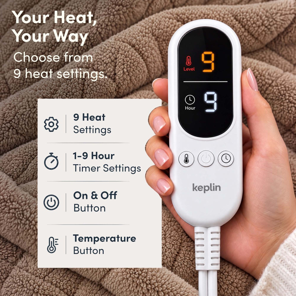 Hand holding remote on taupe jacquard electric throw, 9 heat settings, 1-9 hour timer