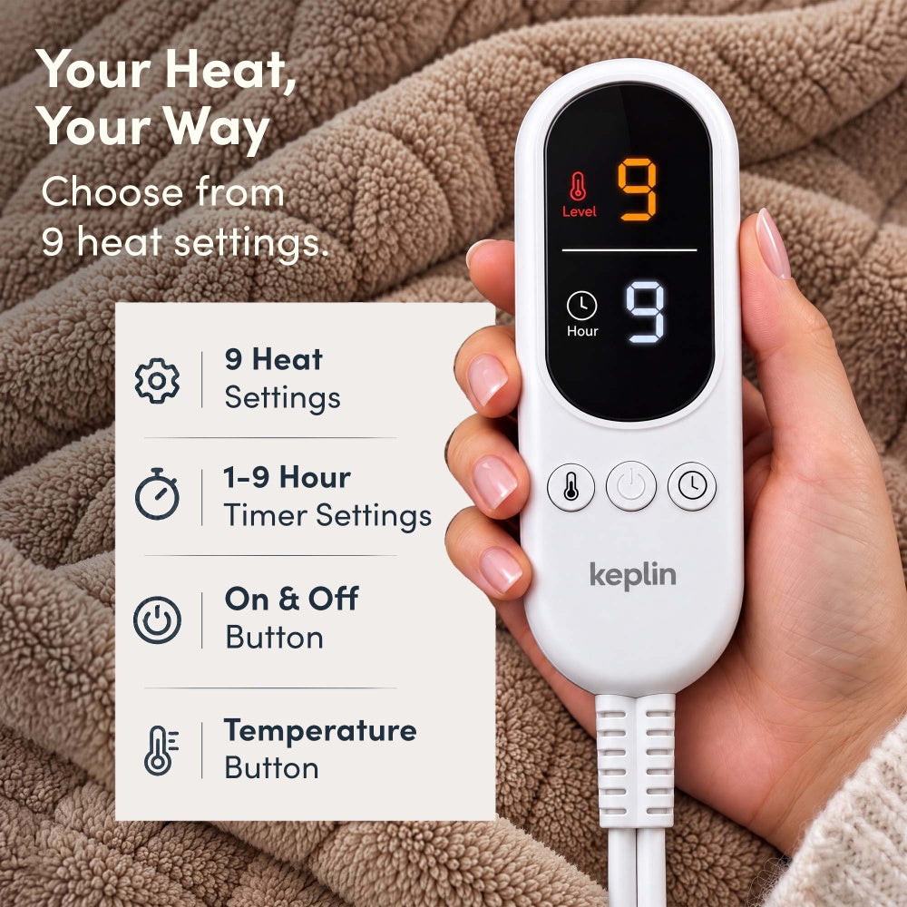 Hand holding remote on vanilla beige jacquard electric throw, 9 heat settings, 1-9 hour timer