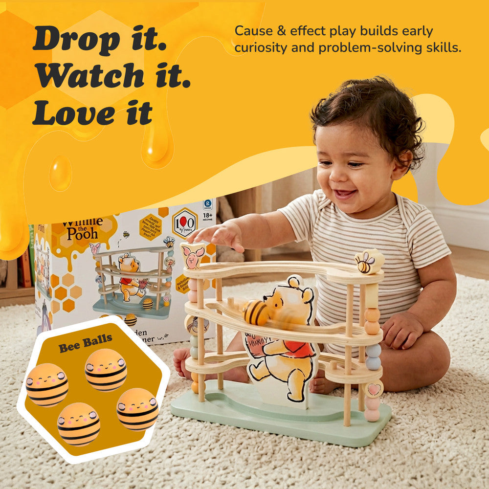 Winnie the Pooh wooden ball tracker toy — close-up of ball run ramps