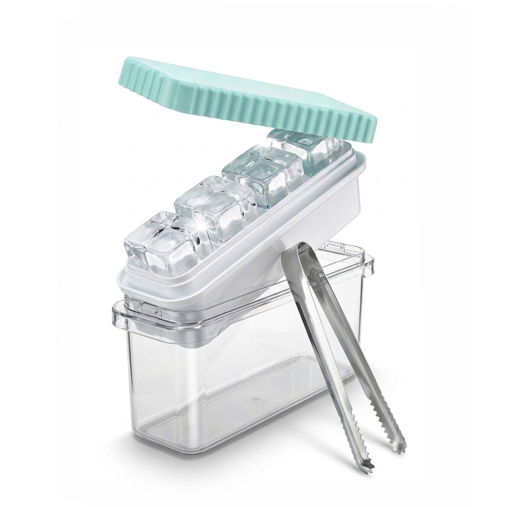 Large ice cube tray with teal silicone lid and clear ice bin and steel tongs beside four ice cubes