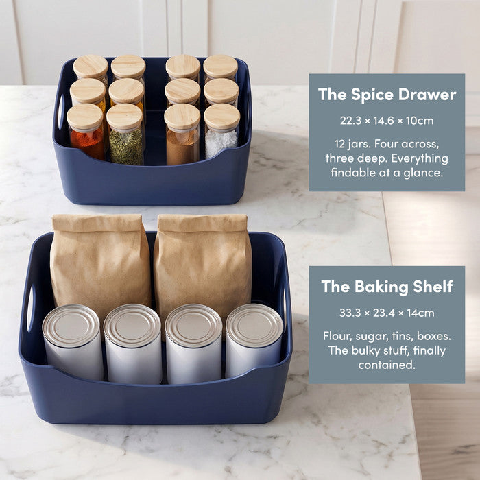 Navy storage baskets holding spice jars, flour and tins – pantry organiser set