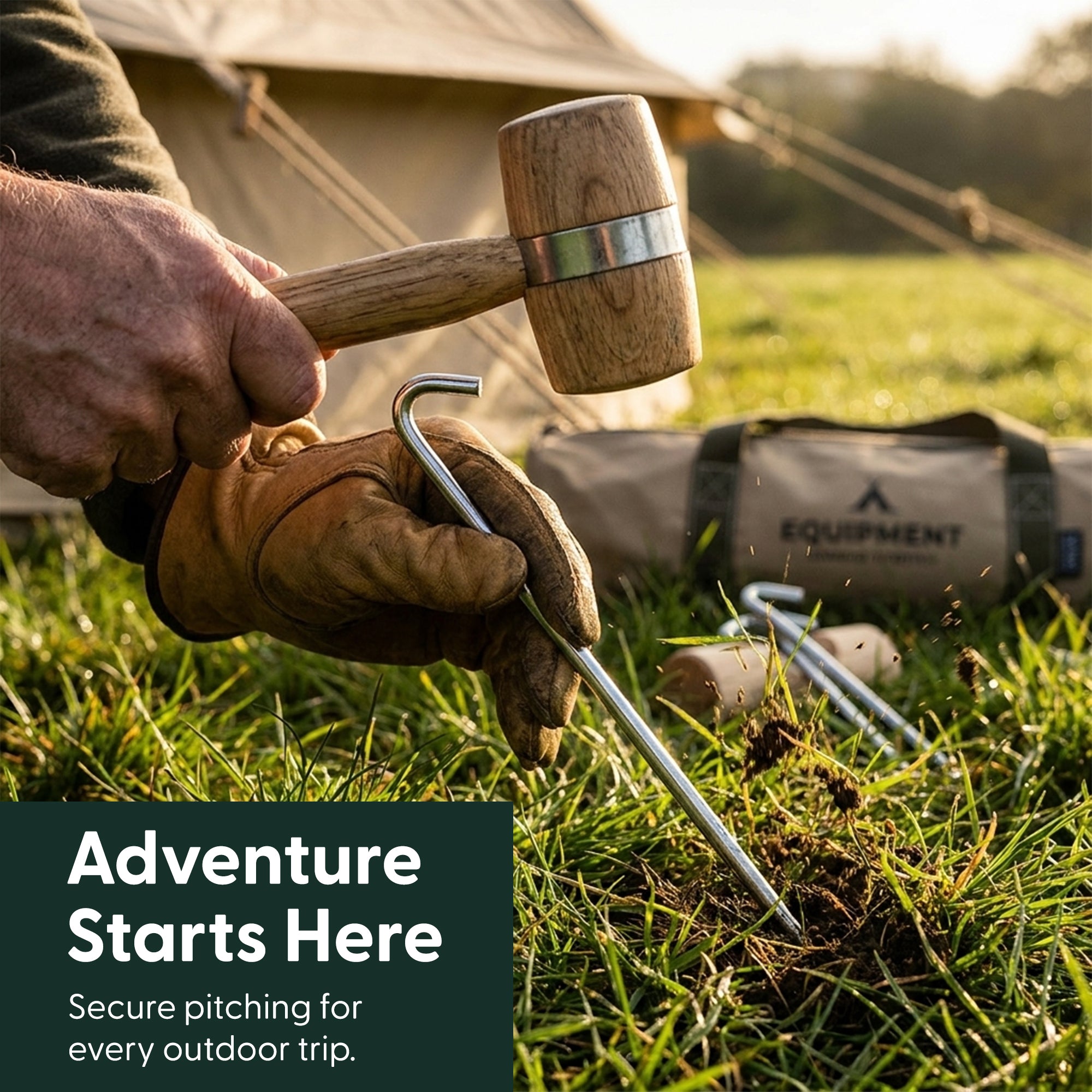 Hammering a galvanised steel tent peg into the ground with a wooden mallet while camping