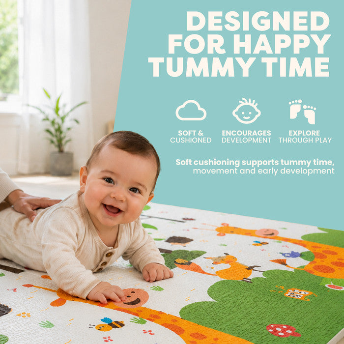Baby doing tummy time on large foam play mat – reversible crawling mat with fun giraffe design