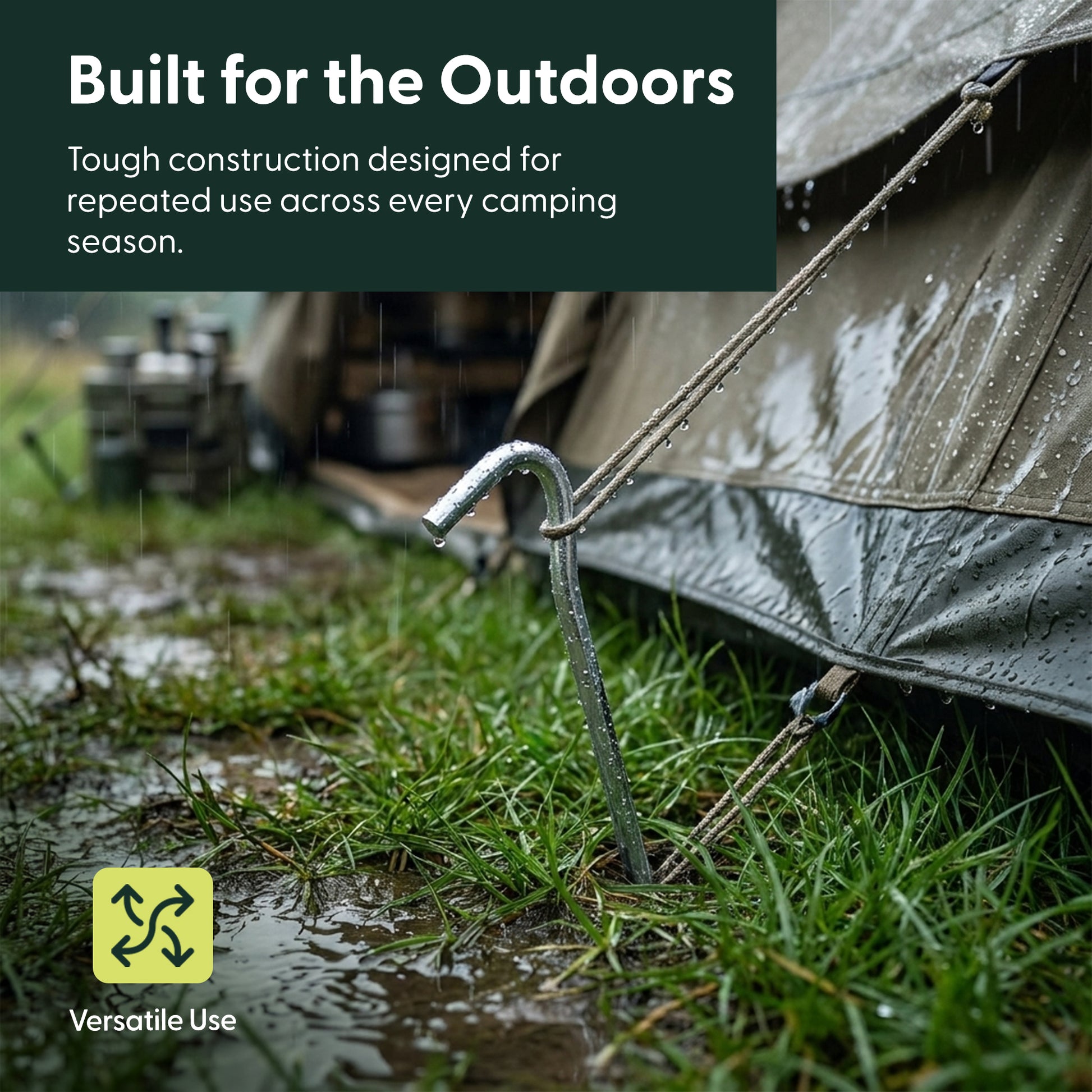 Steel tent peg holding a guy line secure in wet grass during rainy weather