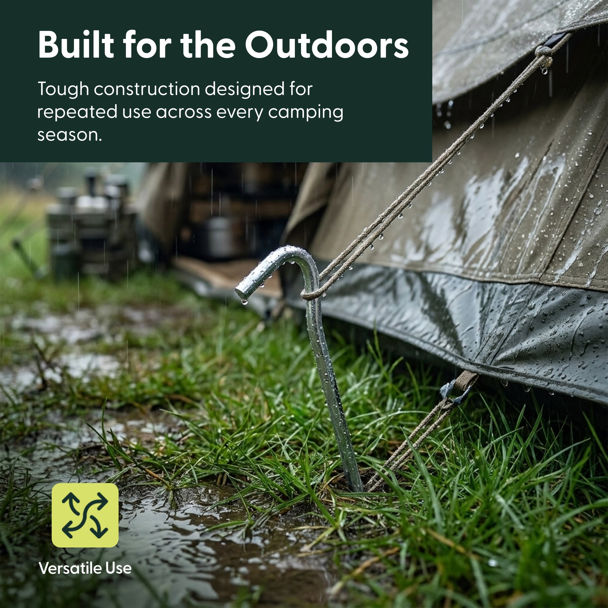 Steel tent peg holding a guy line secure in wet grass during rainy weather