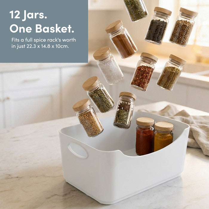 White storage basket holding a full spice rack of 12 jars – cupboard organiser