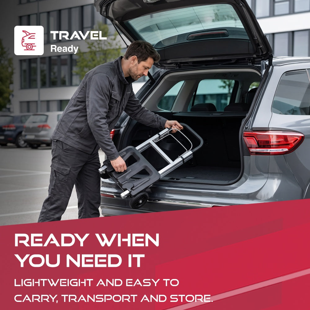 Man lifting the folded Haltons hand truck into a car boot with a Travel Ready badge