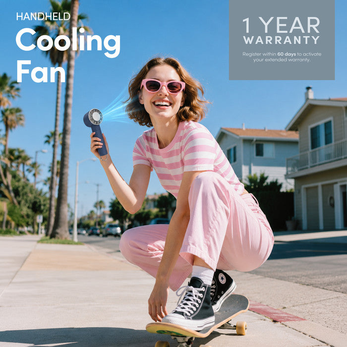 Midnight blue handheld cooling fan with 1-year warranty – lifestyle image outdoors