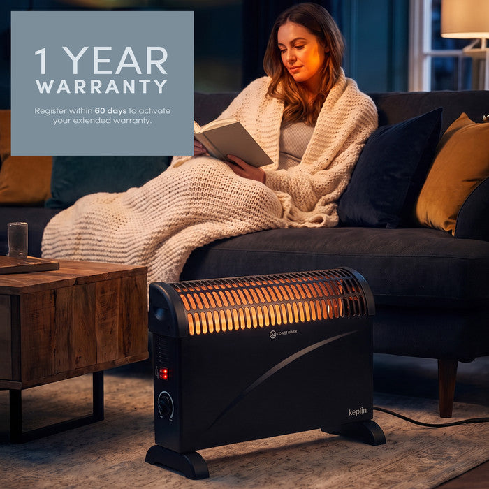 Black convector heater with 1-year warranty registration callout in living room