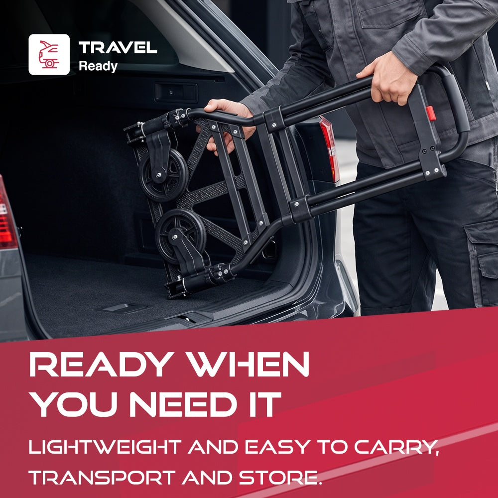 Man lifting the folded Haltons hand truck into a car boot with a Travel Ready badge