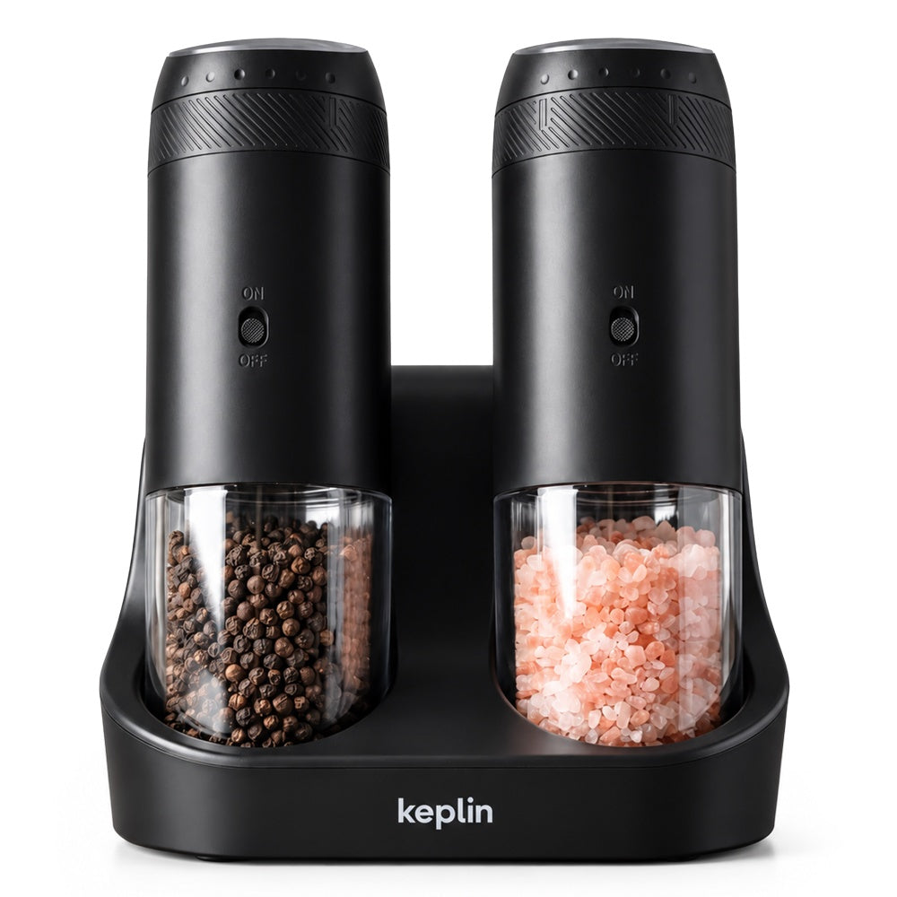 Keplin black rechargeable gravity salt and pepper mills with clear hoppers on a dual charging base