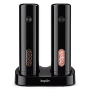 Keplin black rechargeable salt and pepper mill set on a dual charging base with peppercorns and pink salt