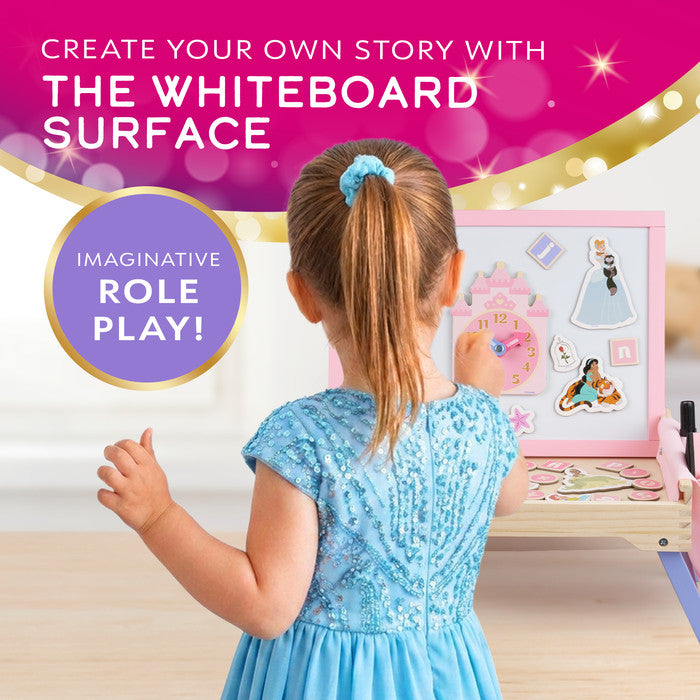 Girl using the whiteboard surface on the Disney Princess creation station for imaginative role play 