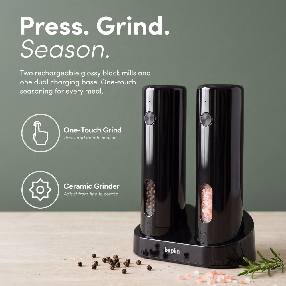 Two glossy black rechargeable mills on a dual charging base with one-touch grind and ceramic grinder icons