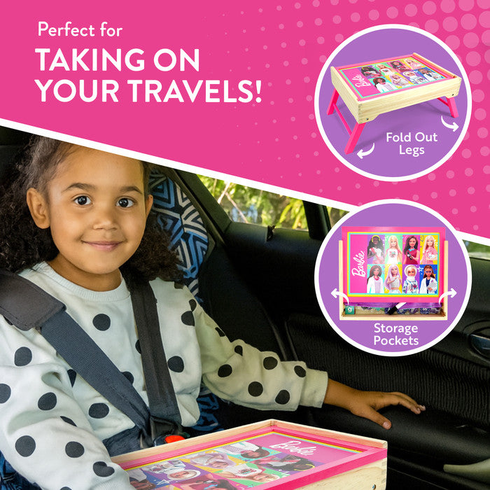 Child using Barbie magnetic whiteboard lap tray for drawing and learning at home